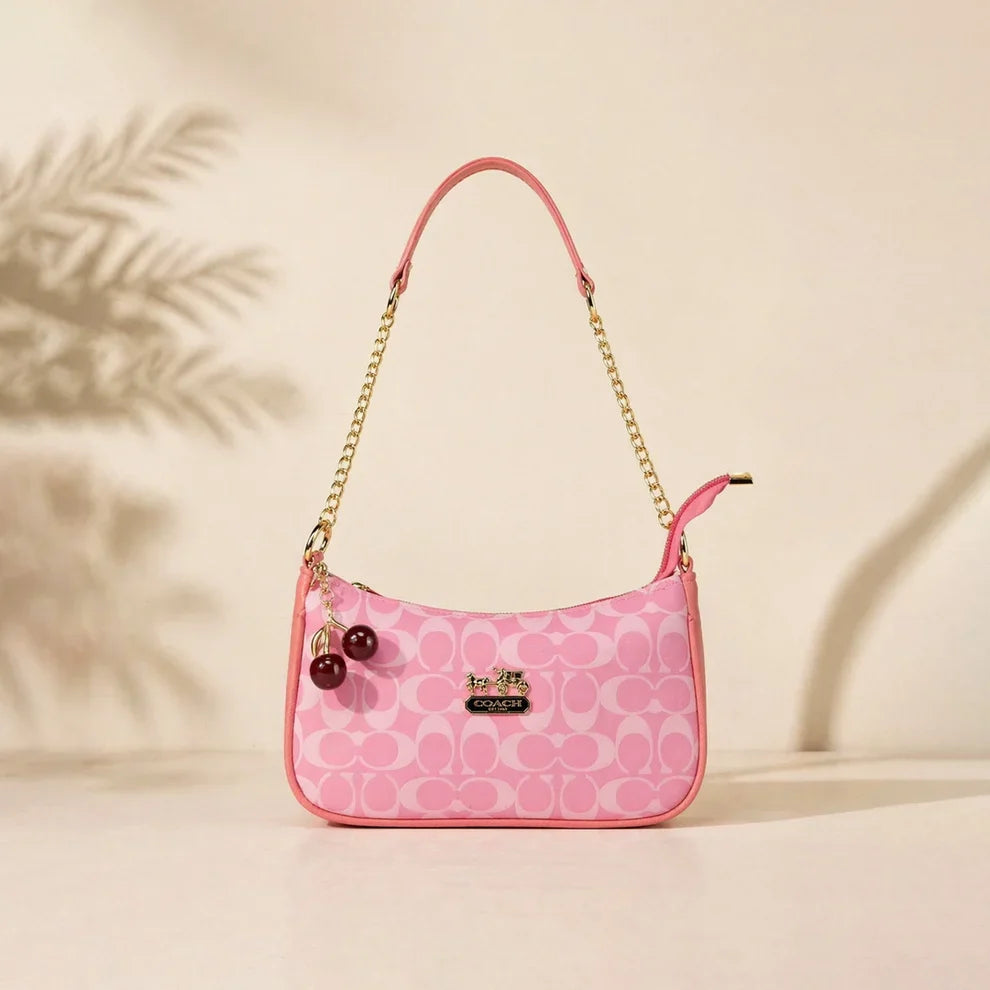 Chic Pink Coach Handbag with Cherry Charms