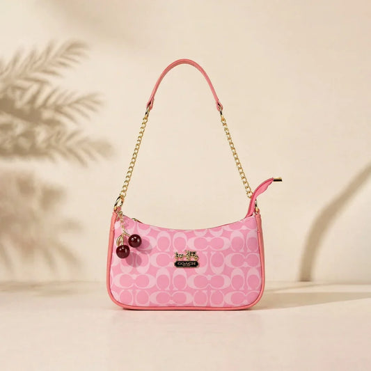 Chic Pink Coach Handbag with Cherry Charms