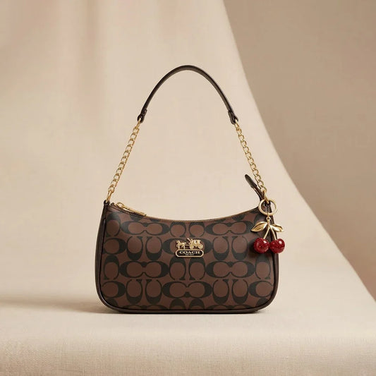 Elegant Coach Brown Monogram Bag with Cherry Charms